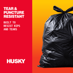 Black tied trash bag on orange gradient background with Husky logo and text claiming tear and puncture resistance