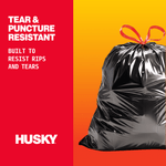 Close-up promotional panel with Husky logo and glossy tied black trash bag highlighting tear-resistant claim