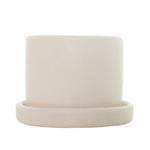 Front-facing semi-matte cream ceramic planter sitting inside a matching saucer on white background