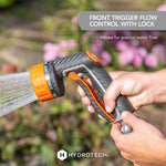 Lifestyle photo of hands using HydroTech front trigger nozzle outdoors demonstrating front trigger flow control with lock