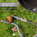 HydroTech nozzle lying on grass next to a rope hose and bucket, with text calling out heavy-duty metal construction