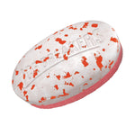 Close-up macro-style image of a speckled Ice Breakers Duo mint piece with branded embossing on white top and pink bottom