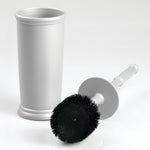Silver toilet brush removed from holder showing round black bristle head beside the tall matching cylindrical container.
