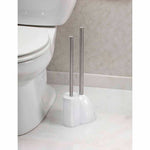 White dual holder with stainless steel-handled toilet brush and plunger beside a toilet