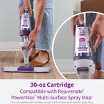 Hands inserting a Rejuvenate PowerMax cartridge into a spray mop with a circular close-up of the cartridge label