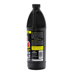 Tall black bottle showing a side label panel of Instant Power Hair Clog Remover on white background