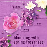 Floral arrangement of jasmine, lilac and peony on a purple wood background with 'blooming with spring freshness' text