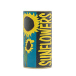 Cylindrical tin with bold sunflower illustration and large vertical “SUNFLOWERS” text on blue and black label.
