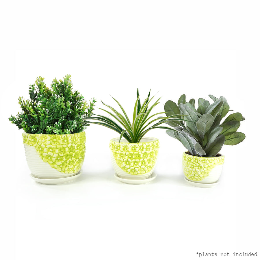 Three K-Cliffs lime-yellow floral ceramic planter pots in graduated sizes displayed with faux greenery on a white background.