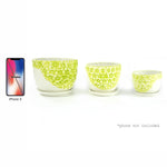 Three K-Cliffs lime-yellow floral ceramic pots with saucers shown side-by-side on white background with phone size comparison graphic.