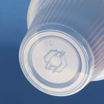 Close-up of the bottom of a clear ribbed plastic cup showing an embossed Katae-style logo and the number 35