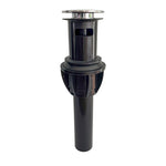Close-up of a black plastic push-button sink drain with chrome pop-up cap and tailpiece