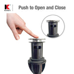 Hand pressing a push-button bathroom sink drain; inset circular detail of the drain top