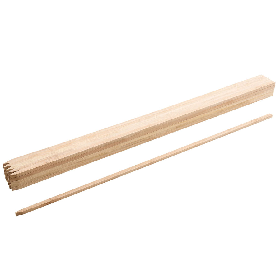 Stack of pointed fir wood garden stakes with one stake laid out on white background
