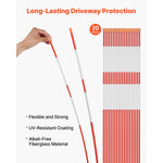 Hand holding a flexible orange-and-white reflective driveway marker next to a neat vertical row of identical rods and feature text.
