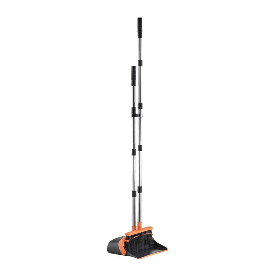 Black and orange upright broom and dustpan set with telescoping metal handle standing on white background.