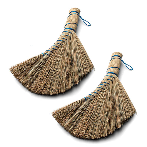 Two natural straw whisk brooms with blue twine bindings shown on a white background.