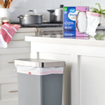 Kitchen lifestyle scene with a Great Value Strong Flex box on the counter and a lined trash can in the foreground