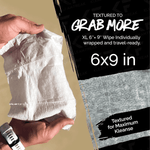 Hand holding a textured Klean Freak wipe next to graphic text stating 6x9 inch XL wipe size
