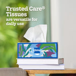 Decorative Kleenex box on stacked books with a tissue pulled up and text 'Trusted Care tissues are versatile for daily use'