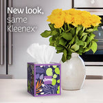 Styled kitchen scene with a floral-pattern Kleenex cube tissue on a counter and a vase of yellow roses