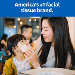 Mother wiping a child's face with a Kleenex tissue under headline 'America's #1 facial tissue brand.'