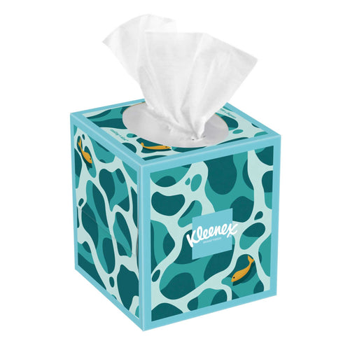 Kleenex cube tissue box with teal abstract pattern, Kleenex logo on front and a white tissue pulled from the top