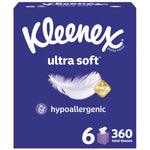 Front-facing Kleenex Ultra Soft cube tissue box design in deep blue with feather graphic and hypoallergenic badge
