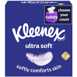 Close-up of a Kleenex Ultra Soft cube box with purple packaging, feather graphic and 'softly comforts skin' copy