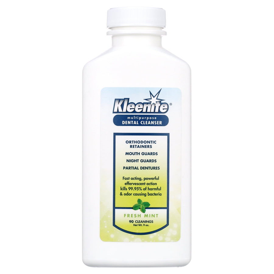 White plastic bottle of Kleenite multipurpose dental cleanser with fresh mint label