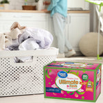 Lifestyle shot of a laundry basket next to a Great Value Ultimate Fresh Paradise Fresh dryer sheets box on a floor