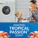 Lifestyle image of mother and child by a washer above blue panel reading "Amazing Tropical Passion scent" with flower accents