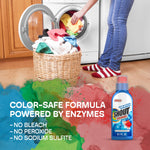 Laundry scene with a person loading a front-load washer and a wicker basket of clothes, colorful splash graphics and Shout bottle inset