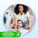 Smiling adult and child playing in laundry room framed in circular crop, lifestyle image for all brand