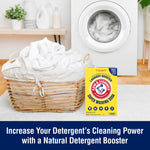 Laundry room scene with wicker basket and a box of Arm & Hammer Super Washing Soda positioned near a front-load washer