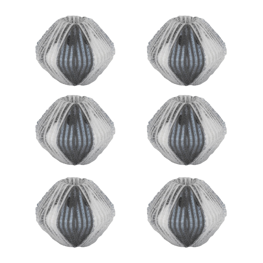 Six white-and-gray mesh lint and hair remover wash balls arranged in two columns on white background.