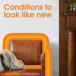Leather chair and throw against a wall with text ‘Conditions to look like new’ and orange graphic accents