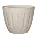 Sand-colored textured polyresin planter with vertical fluted panels and open top