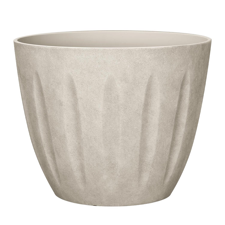 Sand-colored textured polyresin planter with vertical fluted panels and open top