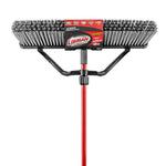 Close-up front view of a Libman 24-inch heavy-duty push broom head with dense black and gray bristles and red handle