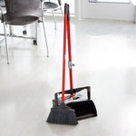 Libman lobby broom and dustpan set displayed in a bright tiled room, positioned near chairs and a door