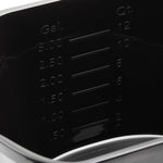 Interior close-up of the black bucket showing embossed gallon and quart measurement markings on the wall