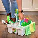 White Libman caddy on a hardwood floor holding green brushes, sponges and cloths while a person reaches into the caddy