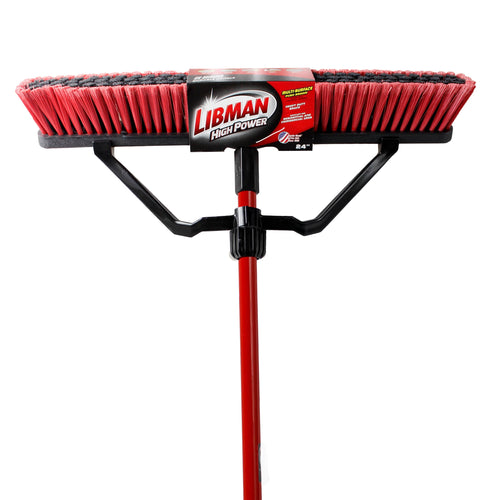 Front-facing red and black Libman push broom head with steel handle attached on white background
