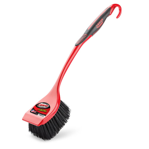 Red and black Libman long-handled scrub brush angled on white background