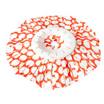 Flat-laid Libman spin mop refill head showing white plastic center and orange polka-dot microfiber strips