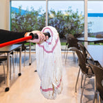 Red-handled mop with white twisted yarn mop head held over a tiled floor in a room with tables and chairs