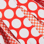 Close-up detail of red-orange and white polka-dot patterned microfiber strips from a Libman Wonder Mop refill