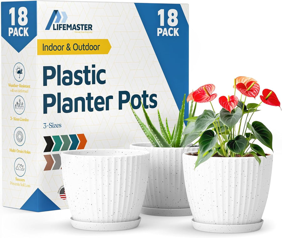 LIFEMASTER branded box and three white speckled ribbed plastic planter pots with saucers, two planted with green foliage