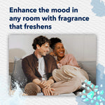 Smiling couple sitting on a couch used as lifestyle image to illustrate room fragrance and mood enhancement